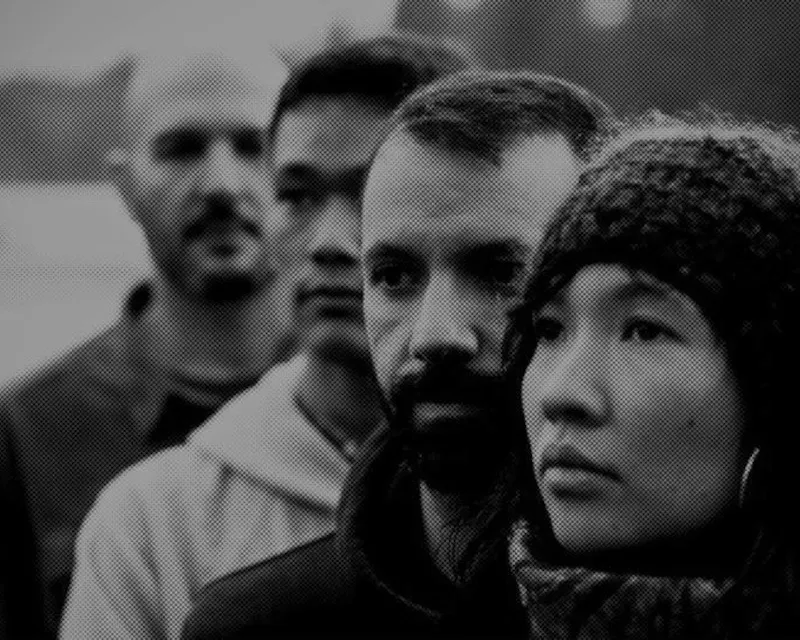 The four members of Amphibioux, photographed outdoors in black and white