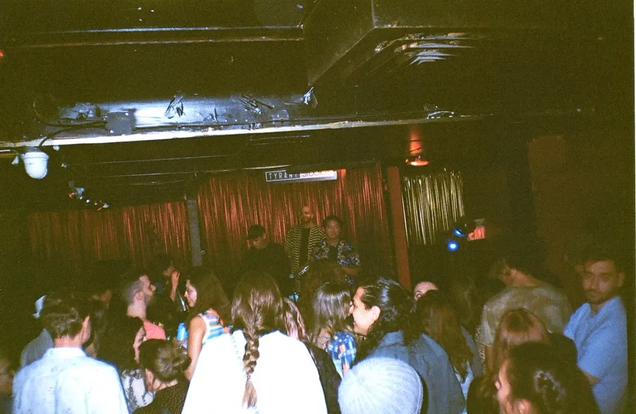 The crowd at Tyrant Studios facing the stage
